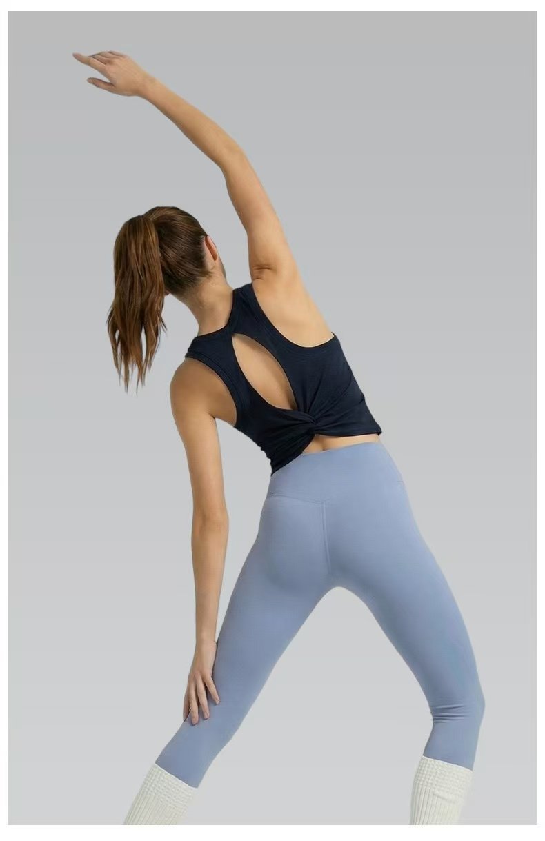 Back view of custom yoga tank showing open back design and fitted silhouette, 4-way stretch fabric