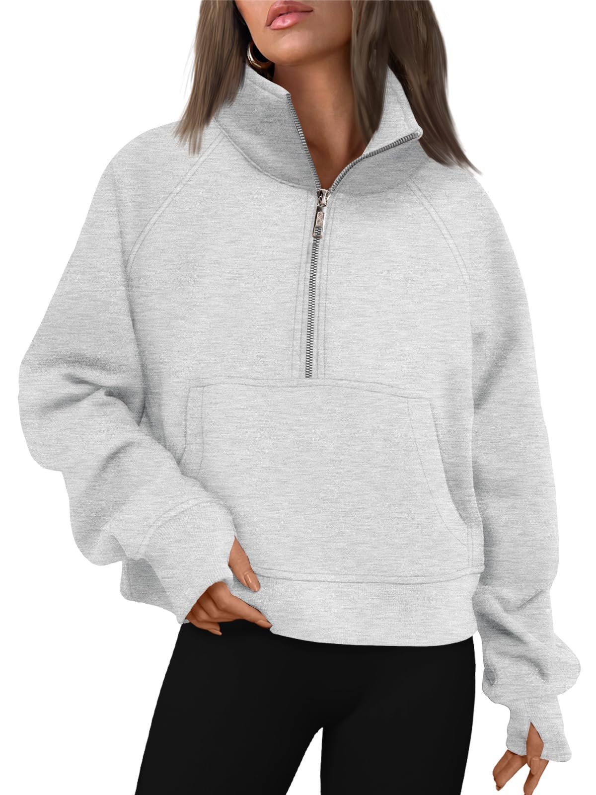 Women's grey oversized half-zip fleece pullover hoodie worn by model, soft cozy sweatshirt for fall winter layering