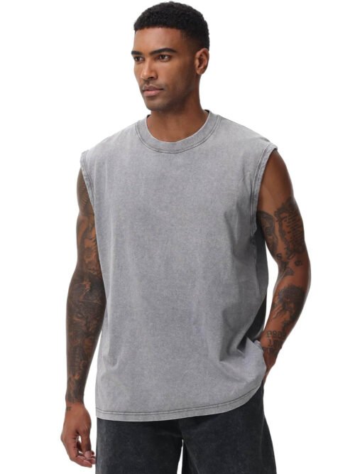 Men's acid wash tank top in vintage grey worn by model, loose fit sleeveless muscle tee for gym and beach