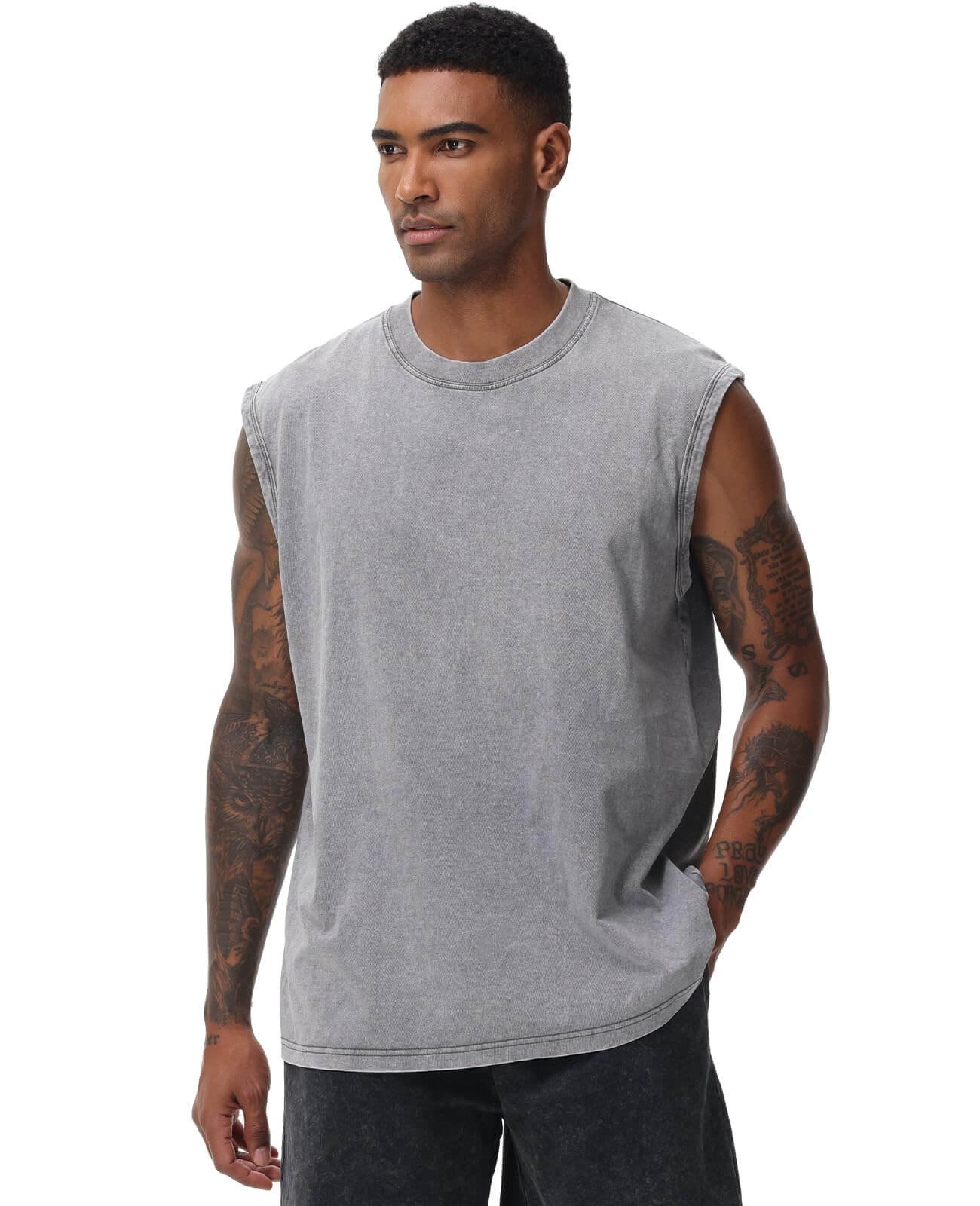 Men's acid wash tank top in vintage grey worn by model, loose fit sleeveless muscle tee for gym and beach
