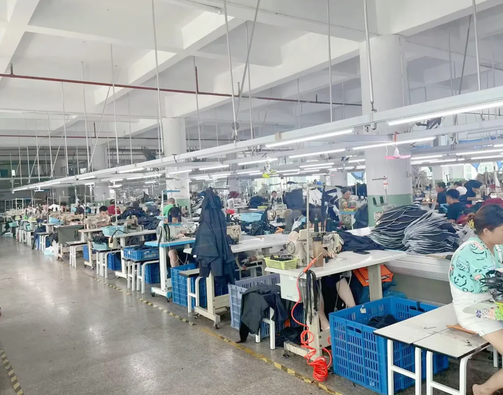 Small batch clothing manufacturer workshop with sewing machines and production line