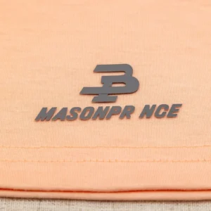 Custom 3D raised silicone heat transfer logo and tagless care neck labels for activewear private labeling on white background
